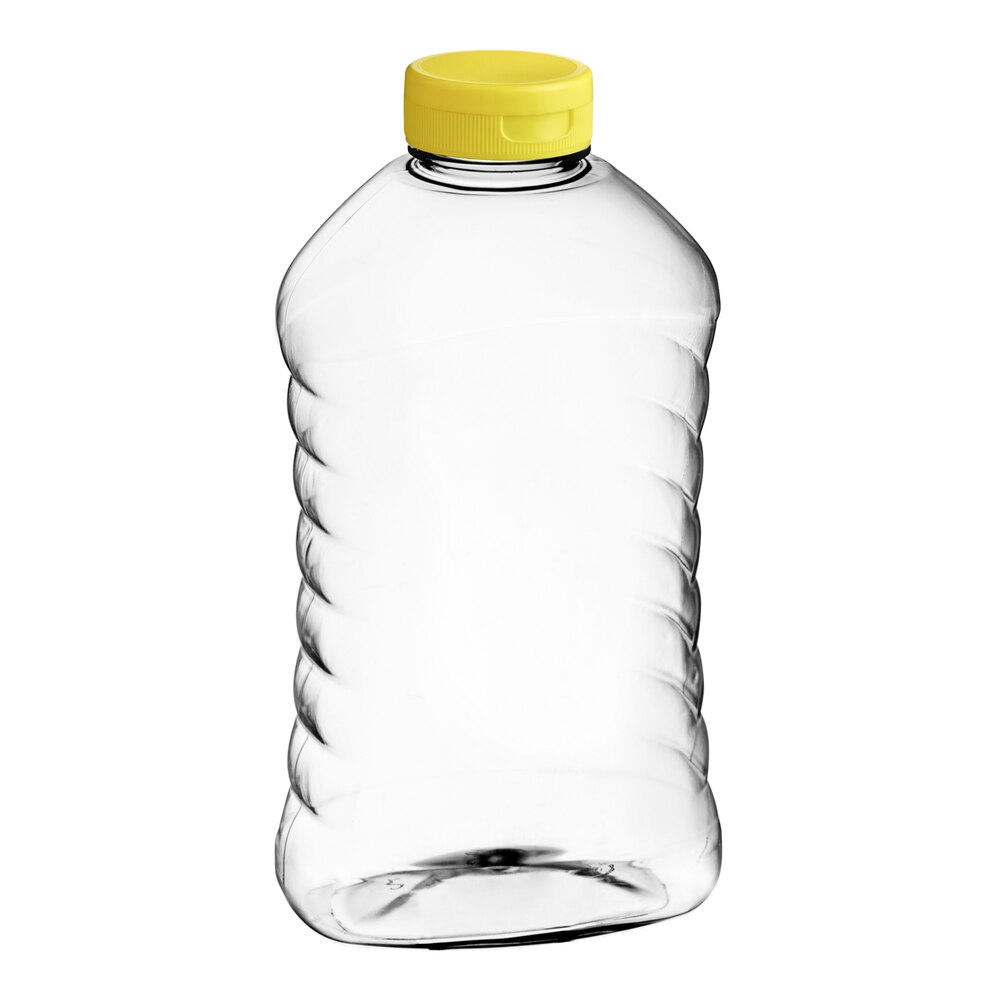 22 oz. (32 oz. Honey Weight) Ribbed Hourglass PET Honey Bottle with Pressure Sensitive Liner Yellow Plastic Flip Top Lid - 159/Case